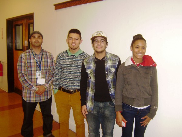 Image: Martin Figueroa, Jeison Peguero, David Landing-leal and Shanique Mitchell participate in a Sociedad Latinas community outreach event in January 2012. (Photo: Jenni Walen)