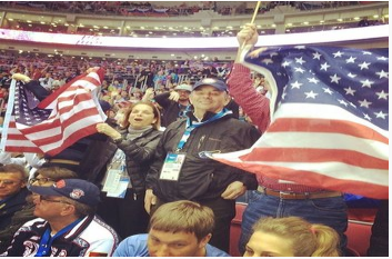 Team USA fans cheer during the USA-Russia hockey game.