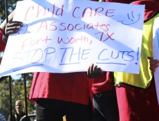 IMAGE: Children stand in front of the Capitol on Oct. 2, 2013 during a rally urging the government to halt spending cuts to Head Start. (Photo: Taylor Hartz, BU News Service)